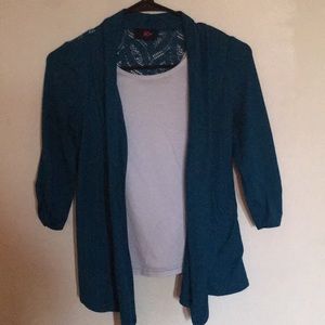 This is a white shirt with a cardigan connected.